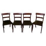 A set of six 19th Century mahogany dining chairs with bar backs, drop in seats on sabre legs
