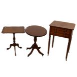 A Victorian mahogany sewing table with three dummy drawers and two occasional pillar tables