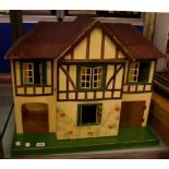 A Lines painted dolls house 50cm high, 60cm wide