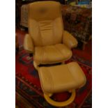 A Stress Less swivel armchair covered in buff leather, with matching foot stool