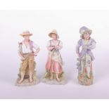 Three Capodimonte style bisque figurines, two peasants and the third in fine dress, the tallest 34cm