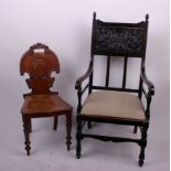 A George IV mahogany hall chair and an Edwardian armchair