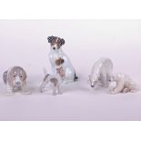 Five ceramic models of animals including a Lladro seated hound puppy, a Copenhagen polar bear and