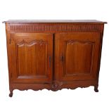 A French cherry cupboard , mid-18th century, with fluted frieze and two moulded panel doors, 119cm