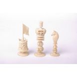 An ornate ivory chess set well carved probably Burmese/Asian with good pierced work. Red and