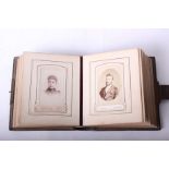 A Victorian leather covered embossed photograph album containing 34 Victorian portrait (35 x