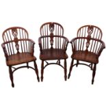 A matched set of six 19th century yew wood and elm Windsor armchairs, a pierced splat, crinoline