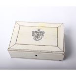 An Anglo - Indian 19th century box covered in panelled ivory, the top with armorial, the inside