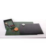 A two piece green leather desk set, a Hermes leather paperweight, office requisites, etc. All