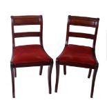 A pair of Regency mahogany bar back chairs with sabre legs and two other early 19th Century side/