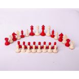 A bone Staunton type chess set, red and white, good colour, king piece 6cm high, felt bases,