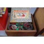 MECCANO: a wooden box containing the remnants of a No 3 set with parts on two trays together with