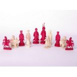 The residue of an ivory early 20th century Chinese elaborately carved chess set, 12 pieces, the