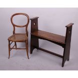 An Arts and Crafts oak bench seat and a canework chair