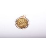 Sovereign, Elizabeth II, 1982, loosely mounted in a 9ct gold pendant mount with an open scrolling