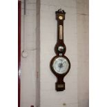 A 19th century mahogany banjo cased syphon tube barometer by Fuller, London, with some losses,