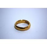 A 22ct gold wedding band, Birmingham, 1962 by Charles Green & Son, size R, 11.1g.