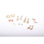 A collection of earrings, including; a pair of coral bead studs, 8.5mm diameter; two pairs of yellow