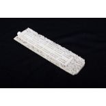 An early 20th century ivory cribbage board, well carved dragon border, 17cm