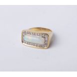 A vintage gold, white opal and diamond oblong cluster ring, the central rectangular cabochon white