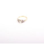 An 18ct stamped yellow gold diamond ring, centre raised 4 claw set, old-mine cut diamond - 0.