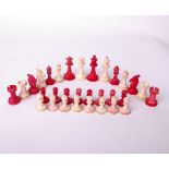 A bone Staunton type chess set, red and white, some colour run, king piece 7cm high. Missing one
