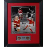 A framed and mounted photograph signed by Denis Law with etched plaque of Manchester United crest