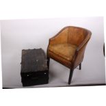 A leather covered library tub chair with brass studding and a small bound trunk