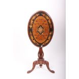 An unusual 19th century small tripod table with oval inlaid walnut top on a eight column pedestal