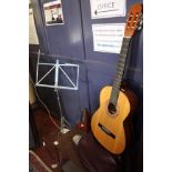 A Bespana acoustic guitar with soft case, music stand and Wittner metronome