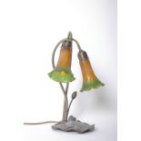 An Art Deco 'Cascade' twin branch table lamp with coloured glass shades and nine Welbrook, four