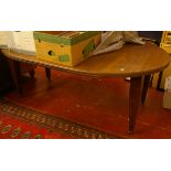 An Edwardian walnut dining table, oval top with single leaf. Top extended 190 x 120cm