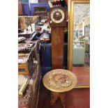 A 1930's 'grandmother' oak cased clock with three train movement, with pendulum; together with an