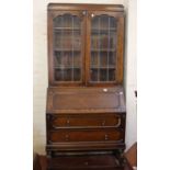 An Edwardian oak bureau bookcase, fitted interior, 90cm wide