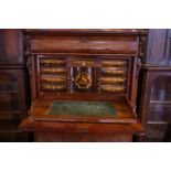 A 19th century Continental mahogany secretaire abbattant with counter weighted fall front