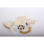 An ivory early 20th century cigarette case (lacking hinge), set of six ivory napkin rings,