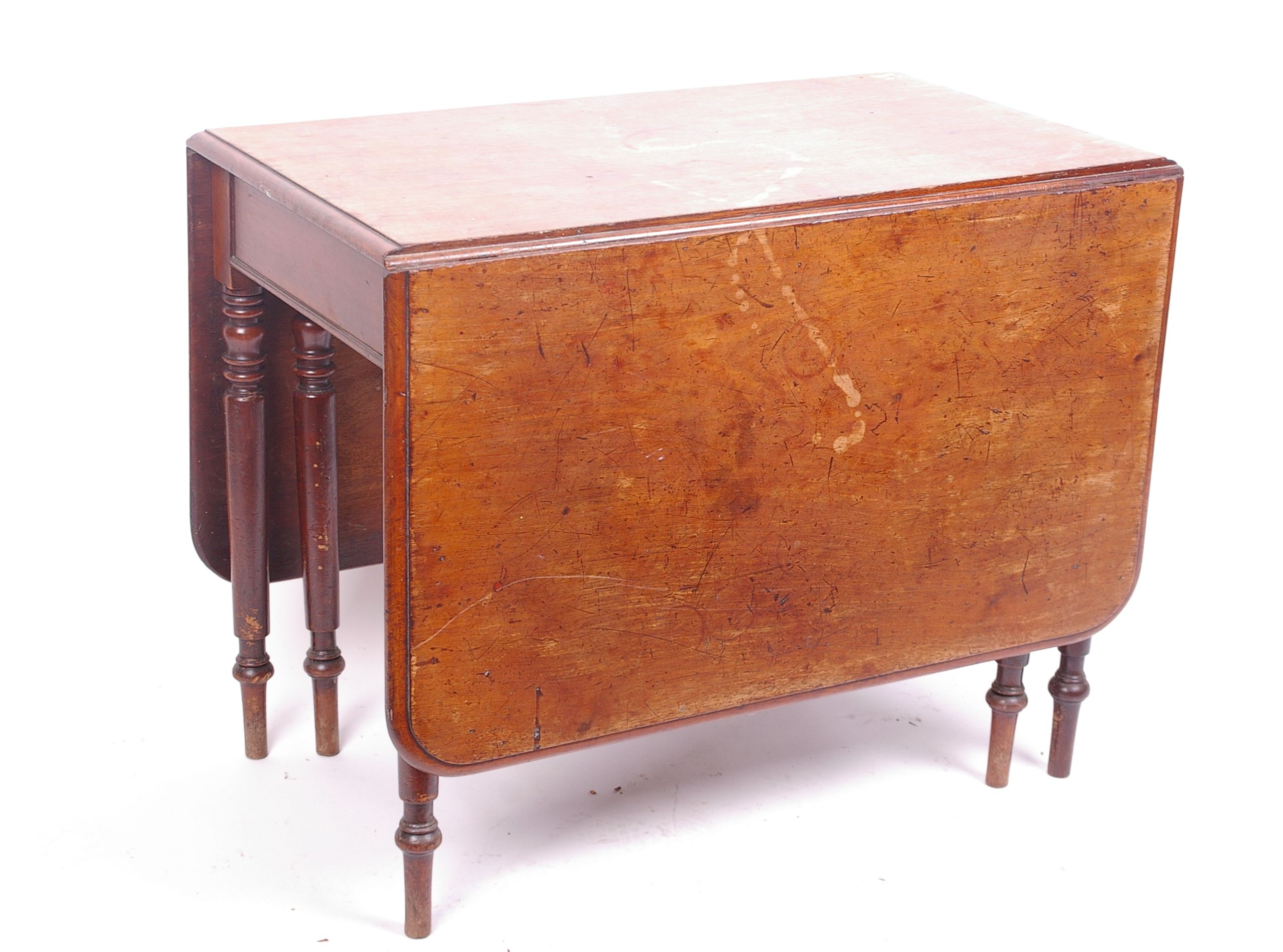 A 19th Century mahogany drop leaf table on turned legs 73cm high, 90cm wide