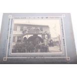 A collection of four unframed early 20th century black and white photographs depicting military