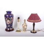 An ornate porcelain lamp base and three other table lamps. (sold as parts)