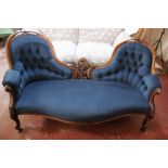 A walnut Victorian double spoon back settee upholstered in dark blue velvet (as new upholstery)