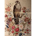 A mid 19th century tapestry: a Falcon perched on a branch with many flowers, 69cm x 52cm . F&G