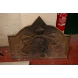 A cast iron fire back with central armorial 70 x 90cm