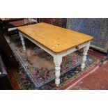 A pine kitchen table, with a frieze drawer and painted legs 182cm length