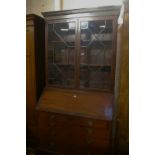 A mahogany bureau bookcase, incorporating associated George III and later elements, the astragal