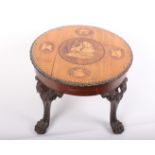 A 19th century mahogany circular coffee table with well carved legs and later inlaid top. Top