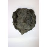 A 19th century cast lead lion mask, 24 x 22cm