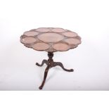 A George III mahogany 'dish top' circular tilt top tripod table. Top diameter 89cm