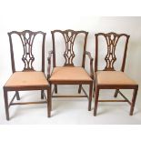 A set of six mahogany dining chairs in George III style, including two armchairs, together with