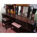 A Stag four piece bedroom suite: dressing table, chest and pair of bedside tables