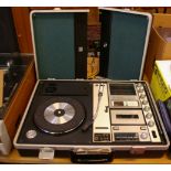 A vintage Sanyo solid state stereo music center in briefcase, with a Steepletone three speed